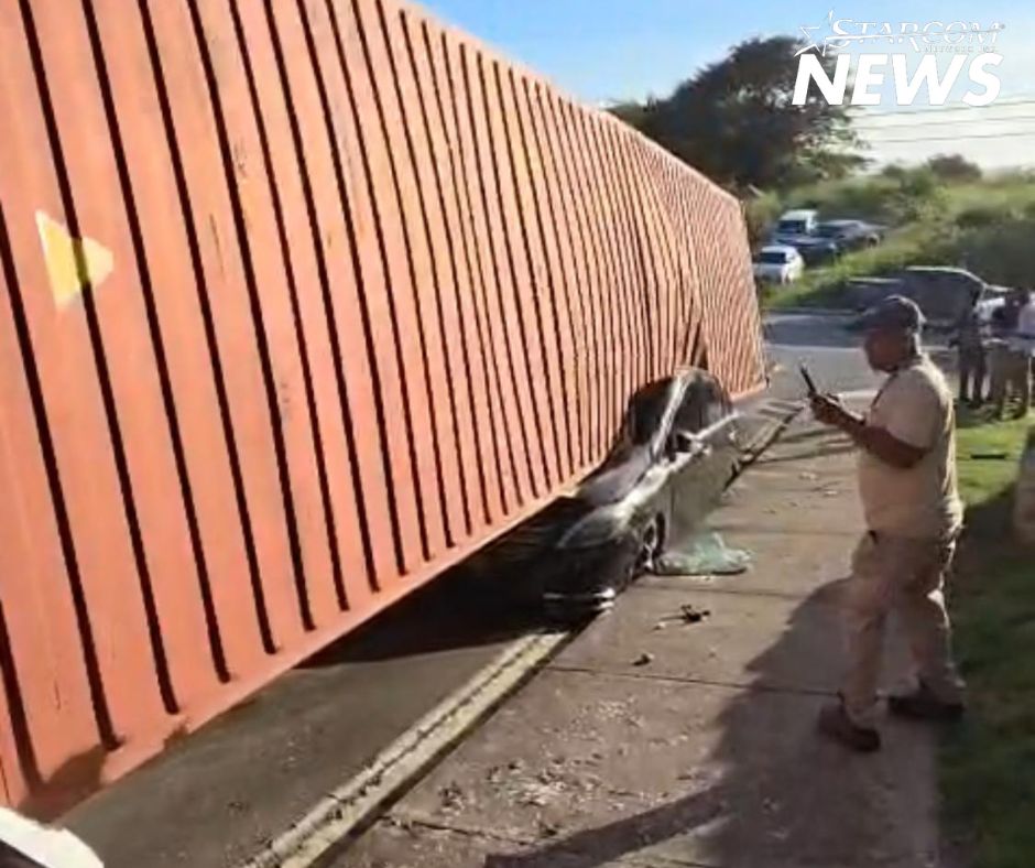 One Injured After 40-Foot Container Truck Overturns, Crushing Car